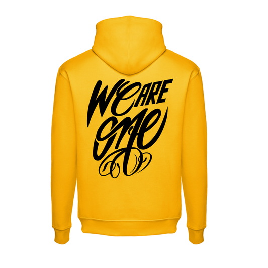 Mustard colored sweatshirt, lettering "we are one"