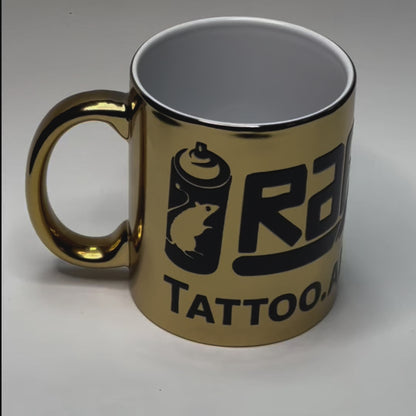 Caneca dourada de ceramica, com logotipo rafnunes